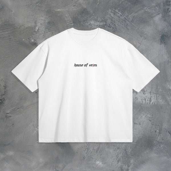 "GROWTH OUTWEIGHS DISCOMFORT" OVERSIZED T-SHIRT IN WHITE