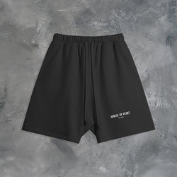 "GROWTH OUTWEIGHS DISCOMFORT" OVERSIZED SHORTS IN BLACK