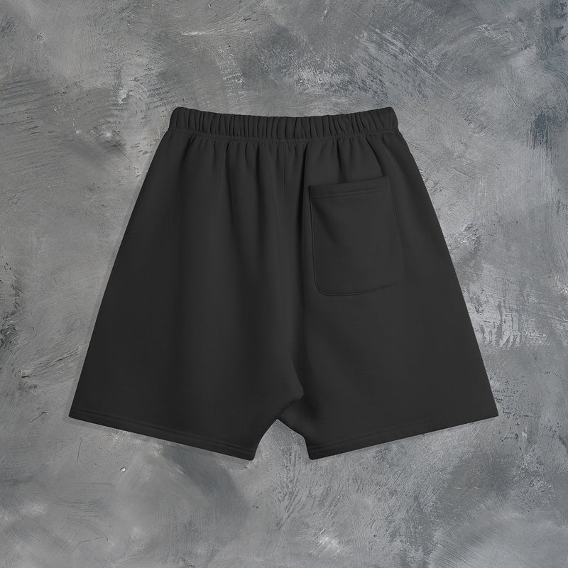 "GROWTH OUTWEIGHS DISCOMFORT" OVERSIZED SHORTS IN BLACK