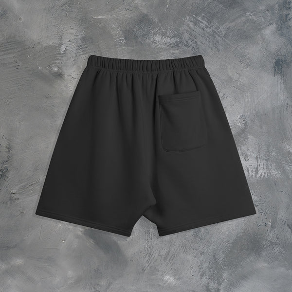 "MEMENTO MORI" OVERSIZED SHORTS IN BLACK